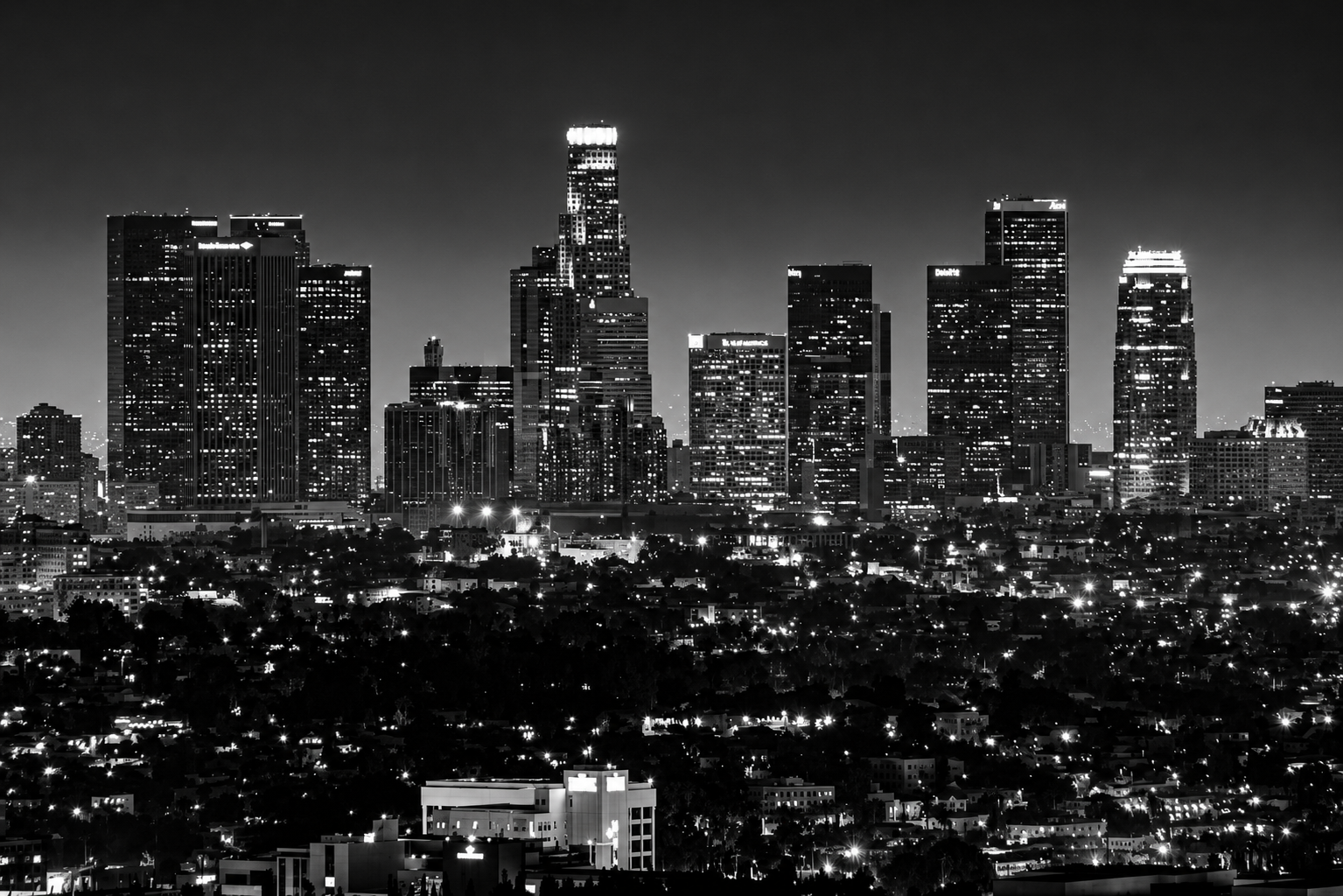 Cinematic wide shot of the Los Angeles skyline with the Hollywood Hills in the distance